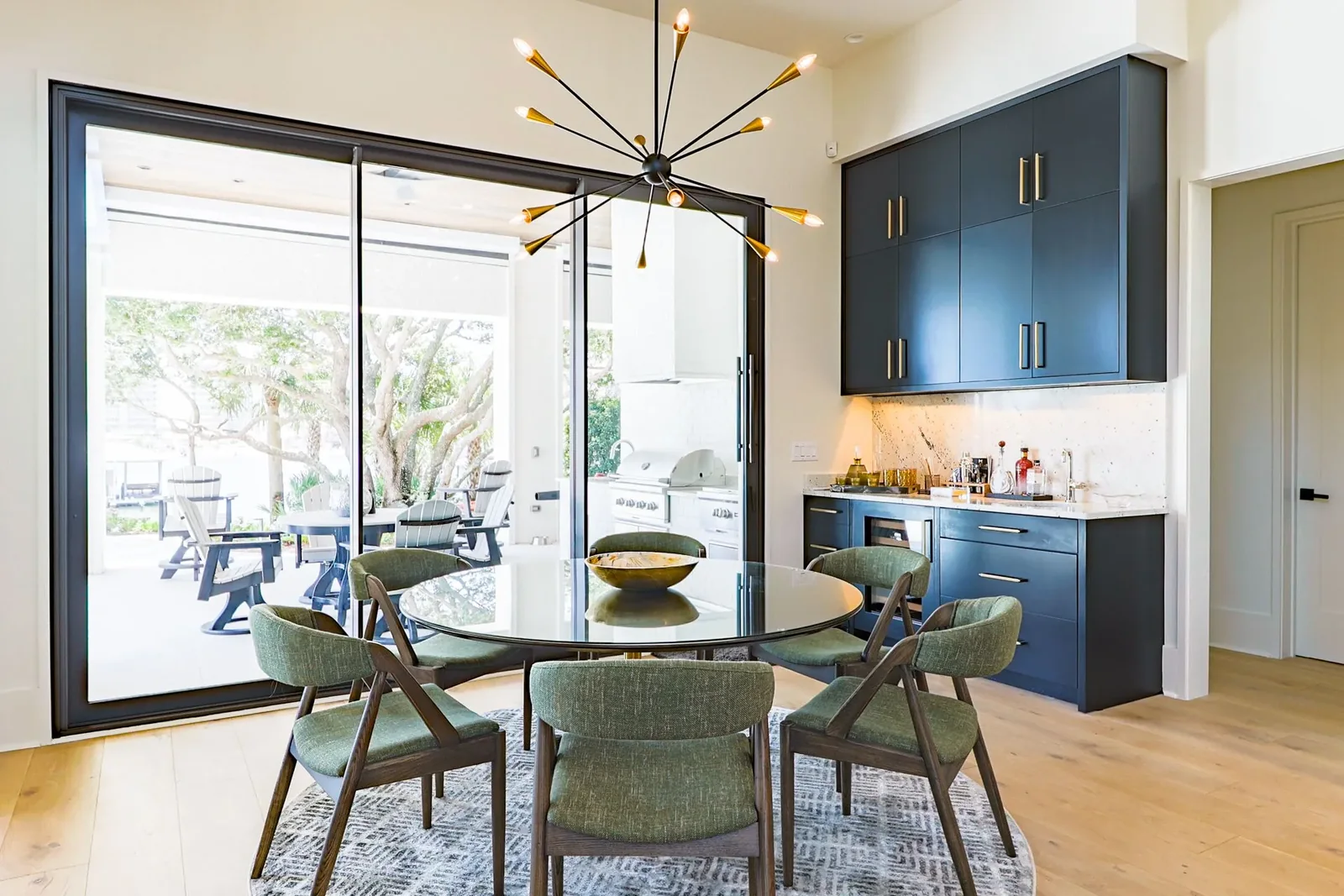 Florida villa project dining area with a dark built-in cabinet