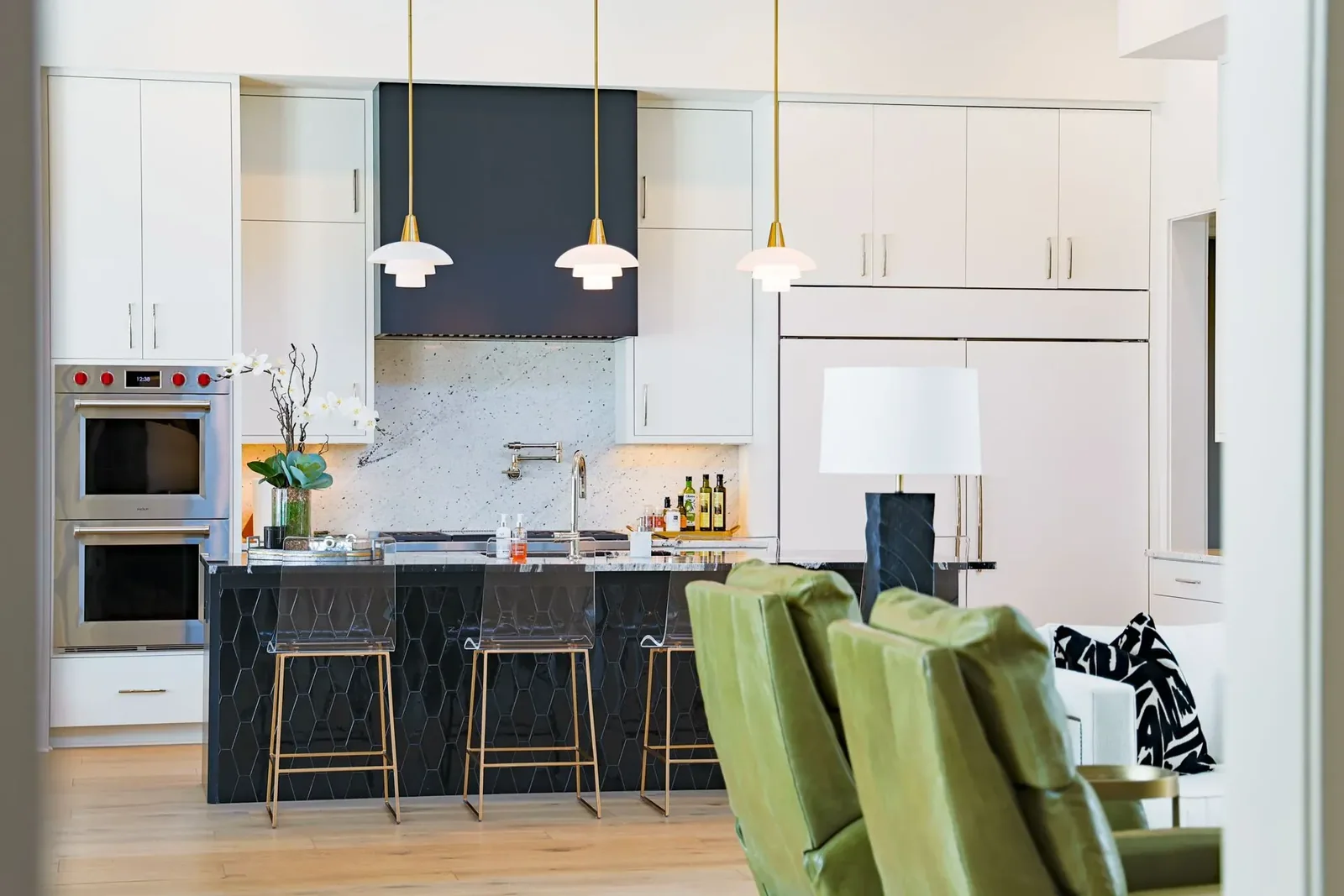 Second Florida villa project kitchen view with white cabinets and a dark island