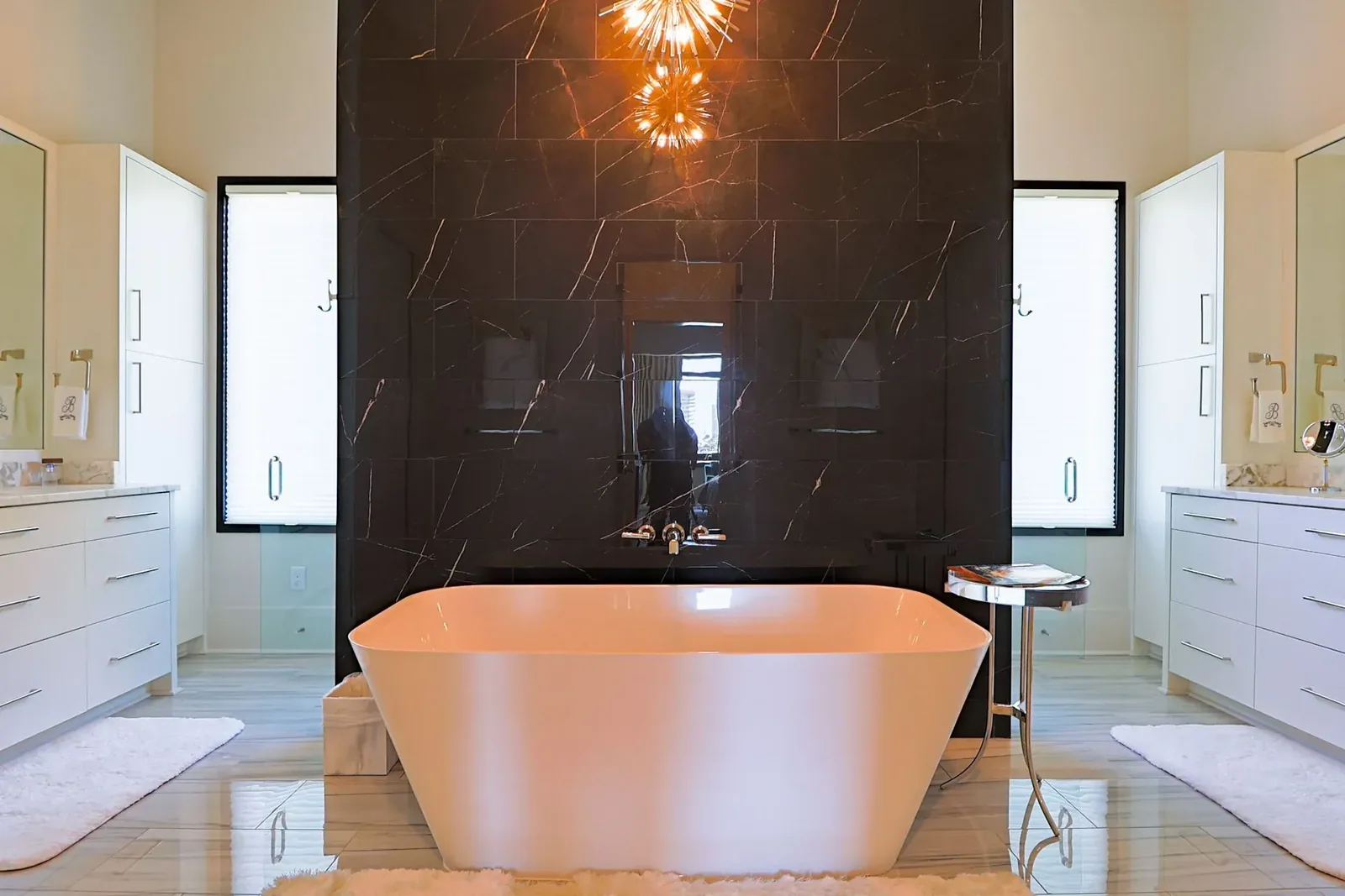 Florida villa project bathroom with two vanity cabinets beside a central bath