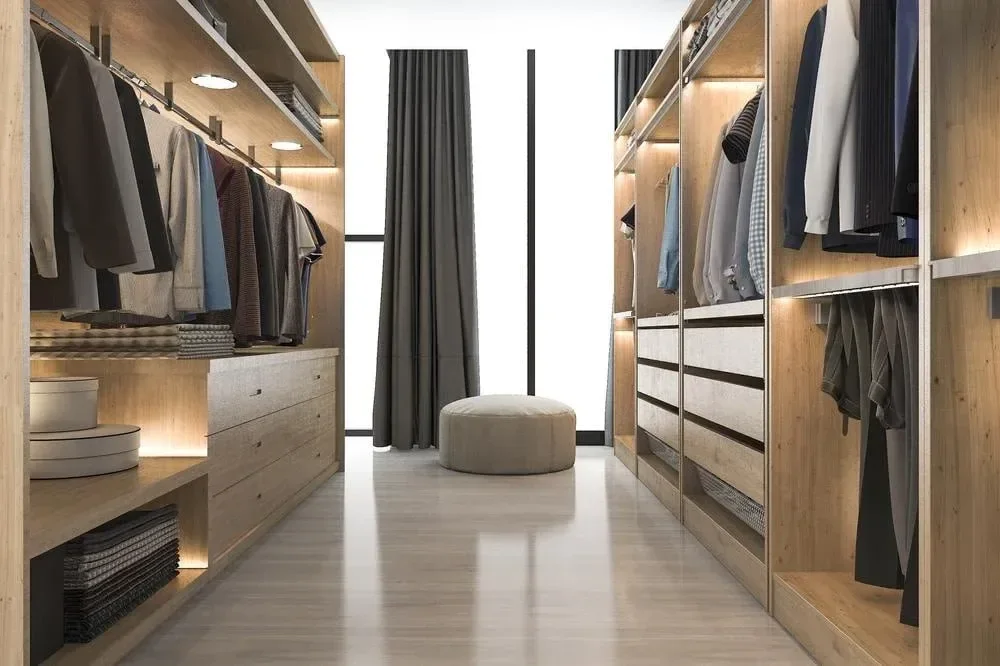 Walk-in wardrobe with storage on both sides and a central passage