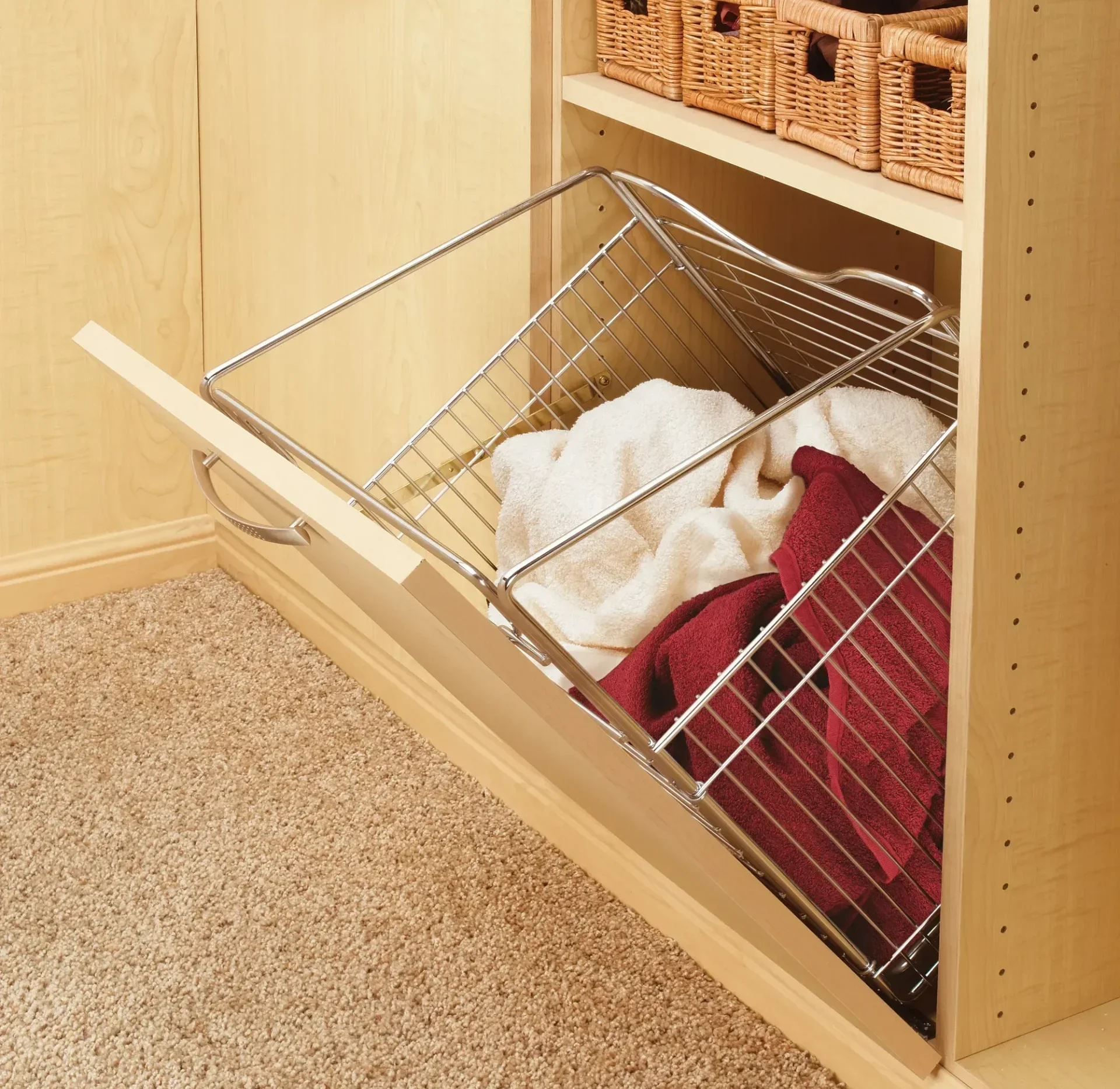 GEORGE pull-out wire hamper with fabric bags extended from a cabinet.