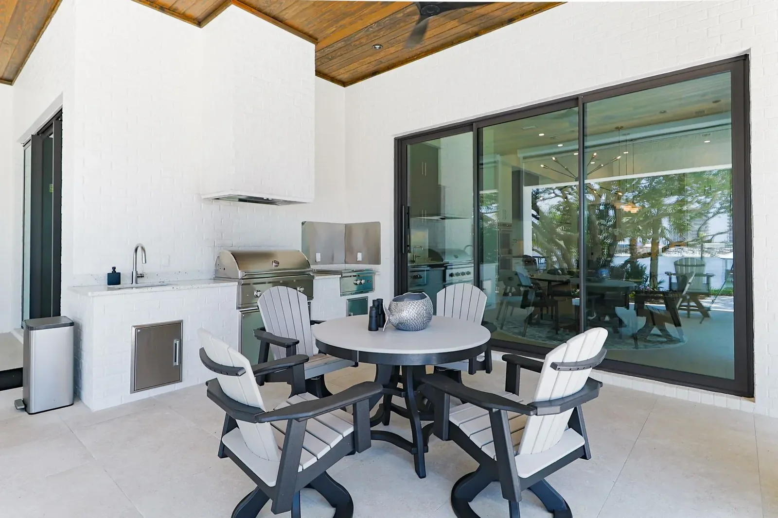 Florida villa project covered outdoor area with a compact cabinet and appliance run