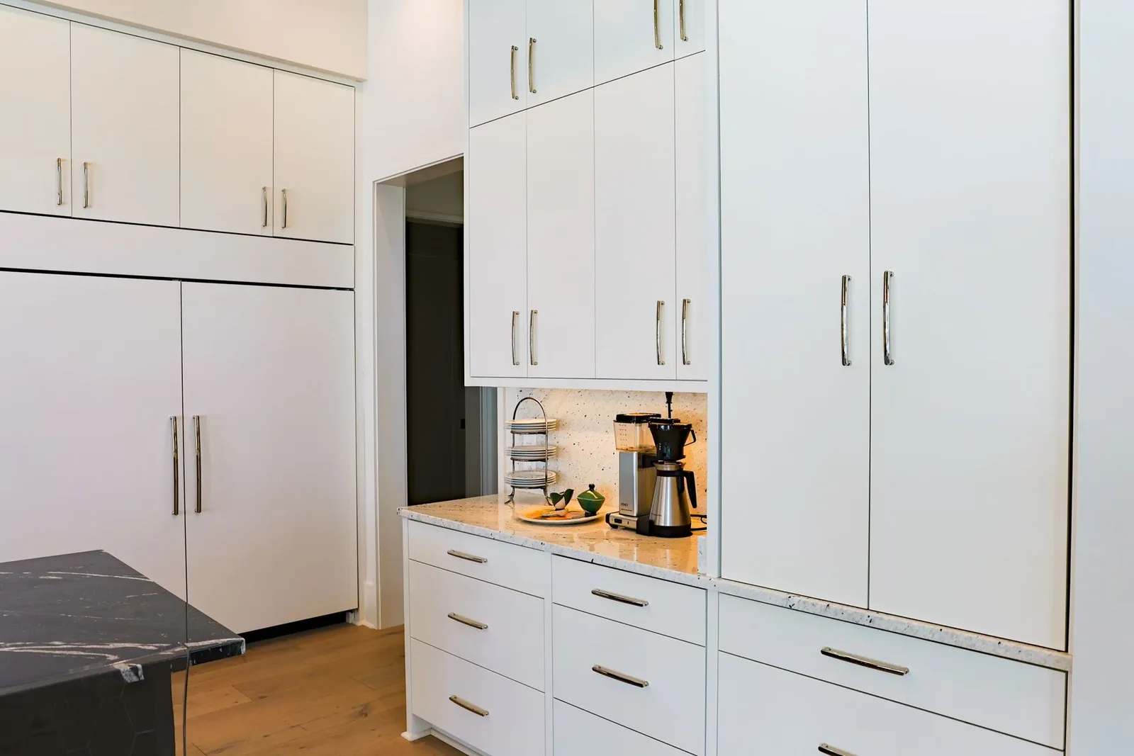 Florida villa project tall cabinets with appliances and a counter niche