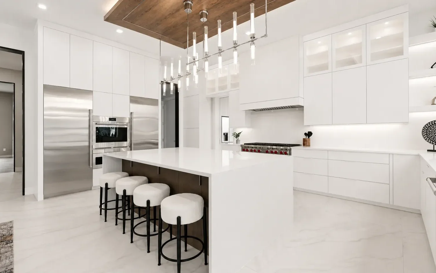 White kitchen with island and tall cabinetry